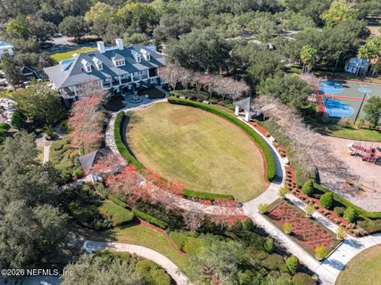 an aerial view of a house with swimming pool and outdoor space