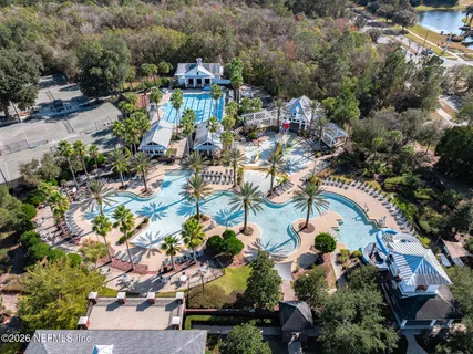 an aerial view of residential house with outdoor space and swimming pool
