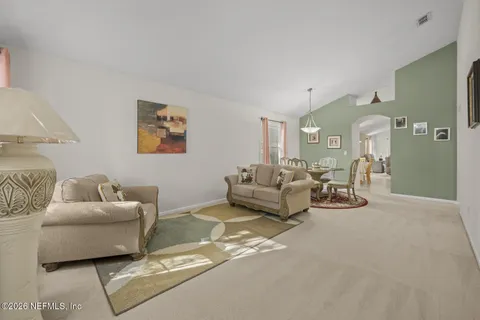 a living room with furniture and a couch