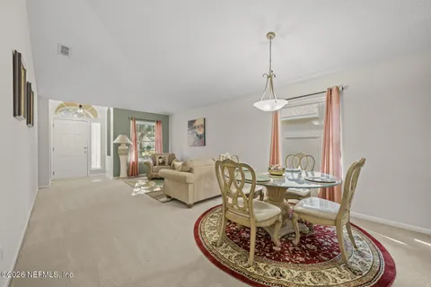 a view of a dining room with furniture