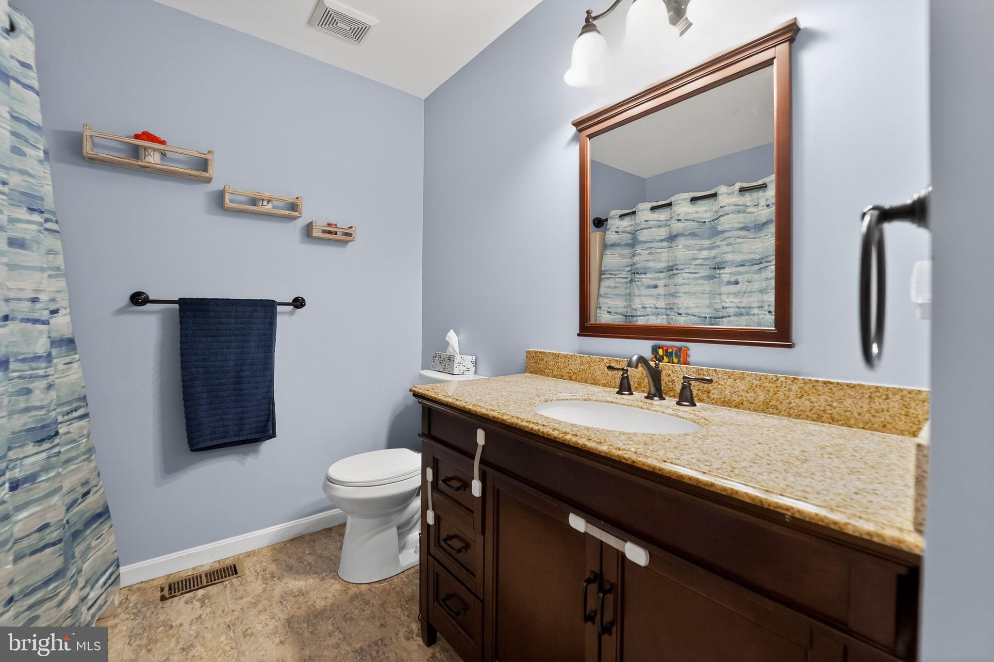 7131 Carmae Road Sykesville, MD 21784 - Photo 12 of 17 Charming bathroom with serene blue tones.