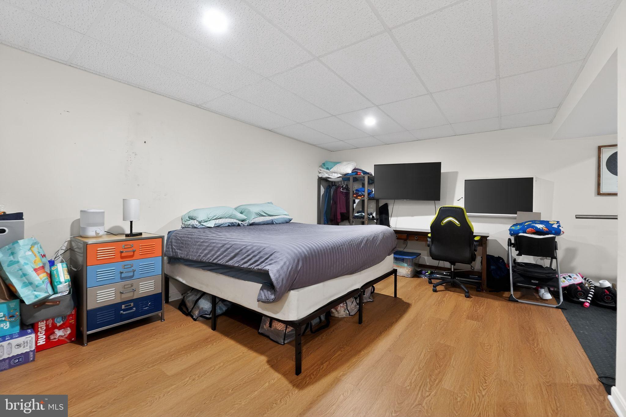 7131 Carmae Road Sykesville, MD 21784 - Photo 16 of 17 Cozy basement retreat with modern workspace.