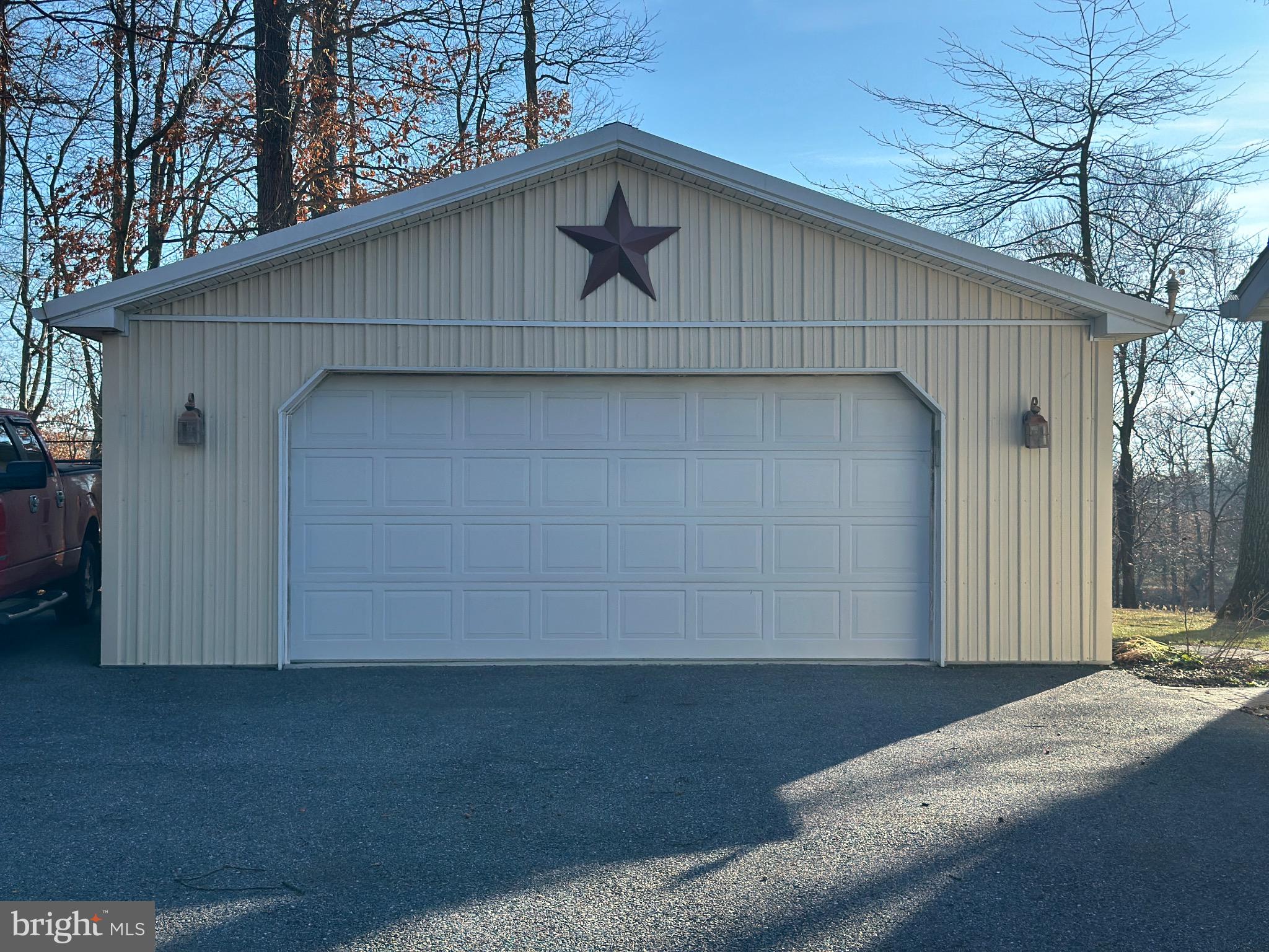7131 Carmae Road Sykesville, MD 21784 - Photo 2 of 17 Charming garage with rustic star accent.