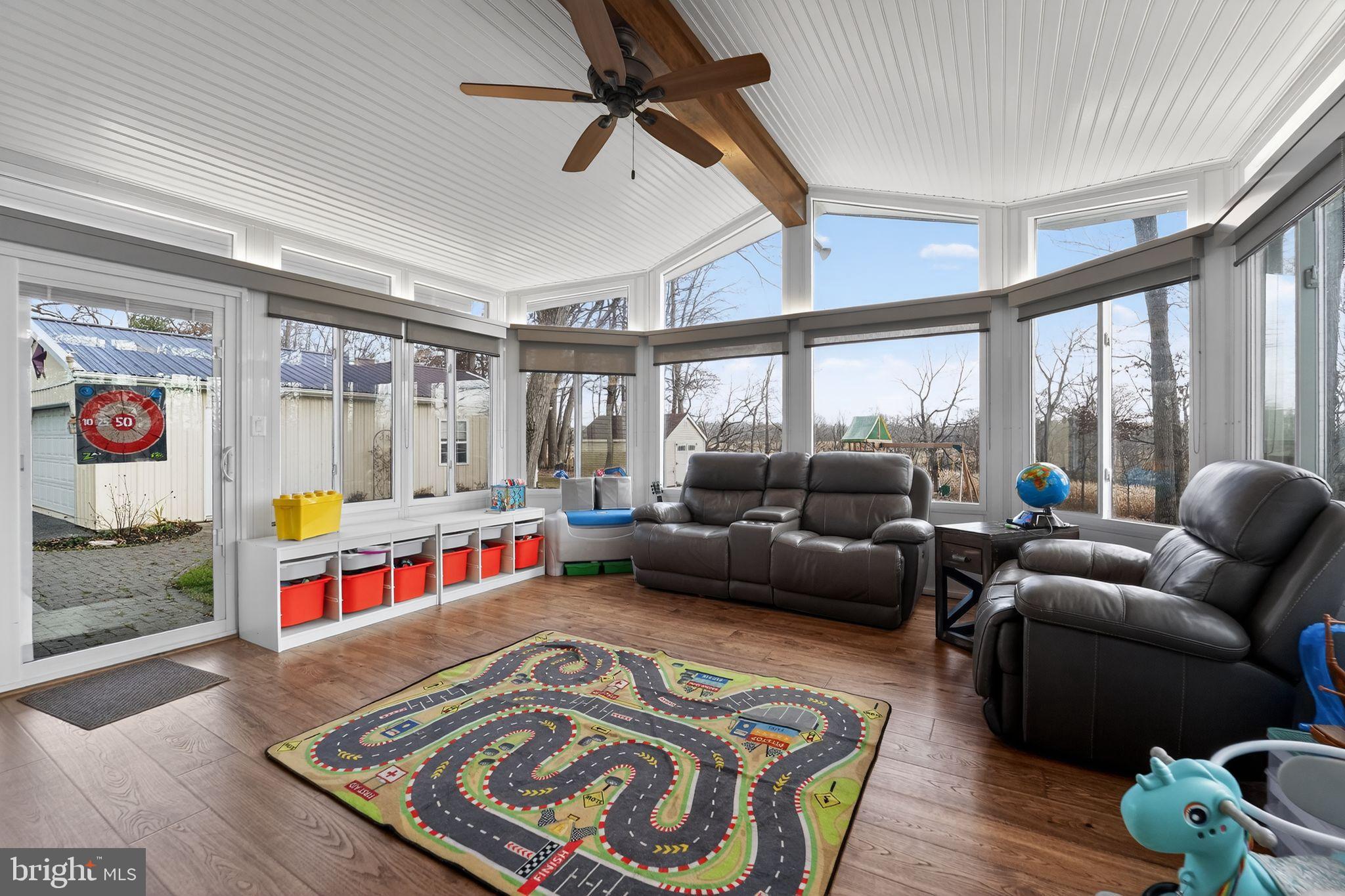 7131 Carmae Road Sykesville, MD 21784 - Photo 8 of 17 Bright sunroom with playful design elements.
