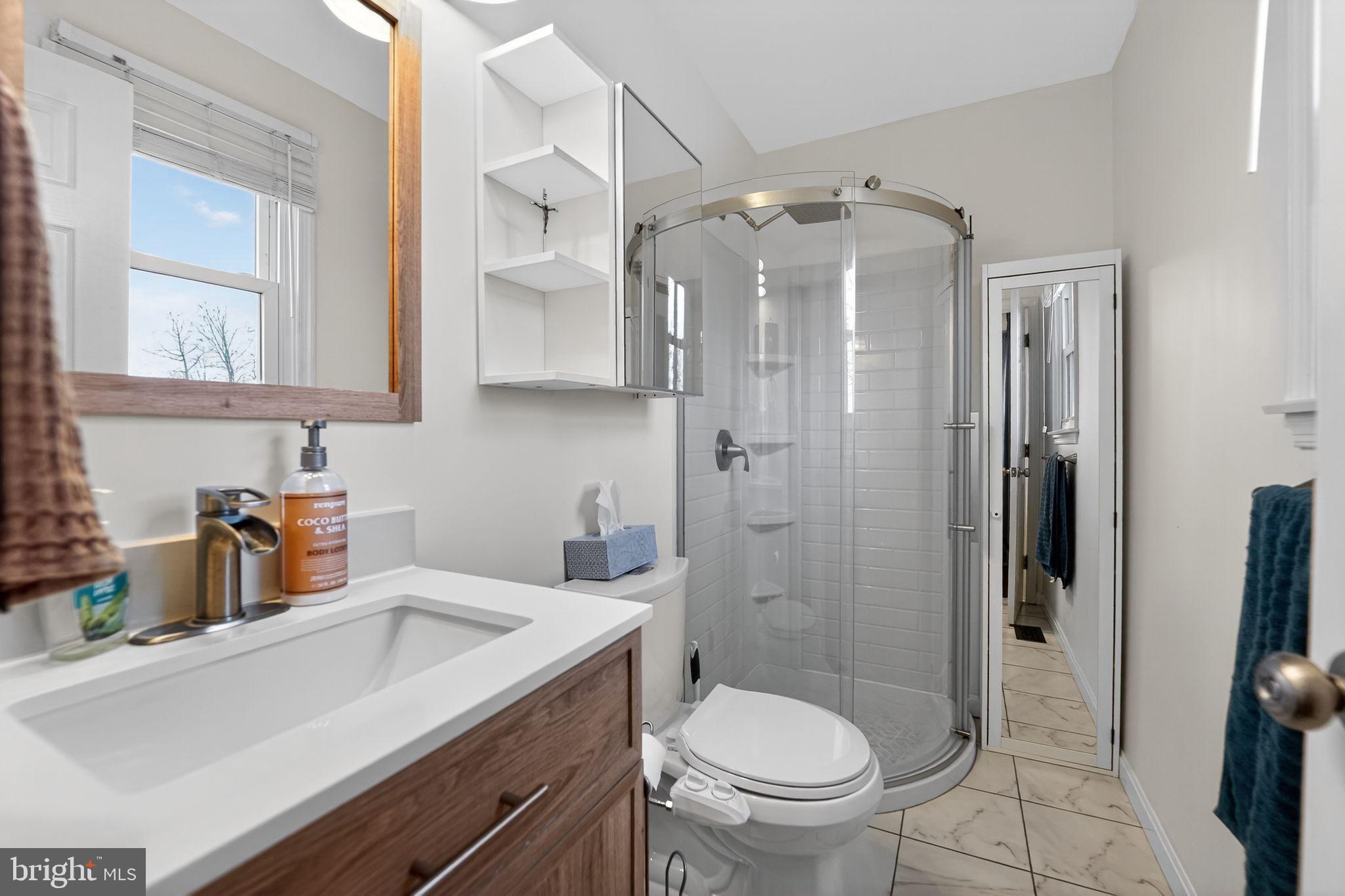 7131 Carmae Road Sykesville, MD 21784 - Photo 10 of 17 Modern bathroom with sleek glass shower.