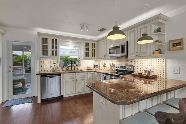 a bathroom with a toilet and a shower curtain
