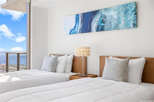 a bedroom with a bed and a lamp with window