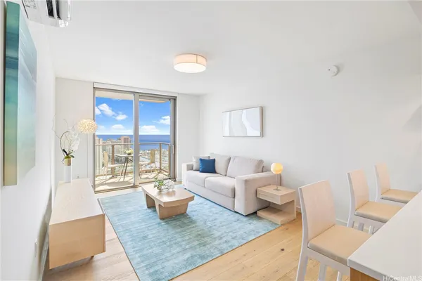 a living room with furniture and a large window