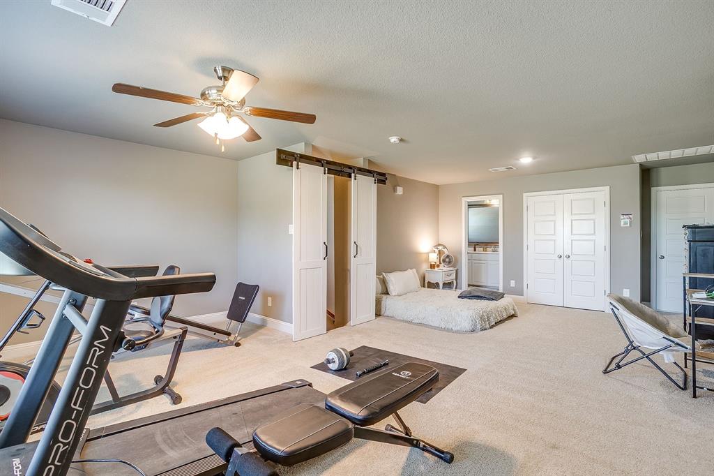 112 Lone Star Way Godley, TX 76044 - Photo 15 of 40 a living room with furniture and a ceiling fan