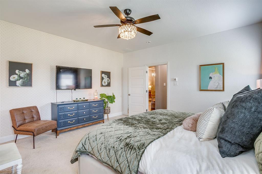 112 Lone Star Way Godley, TX 76044 - Photo 19 of 40 a bedroom with a bed and a dresser