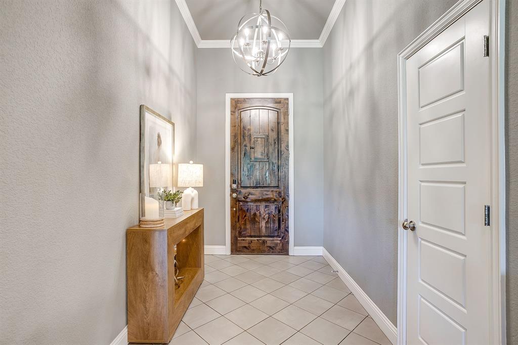 112 Lone Star Way Godley, TX 76044 - Photo 3 of 40 a view of livingroom with hallway and chandelier