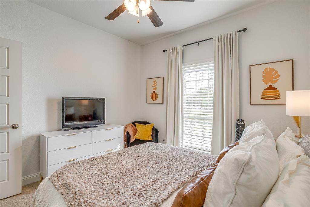 112 Lone Star Way Godley, TX 76044 - Photo 31 of 40 a bedroom with a bed and a flat screen tv