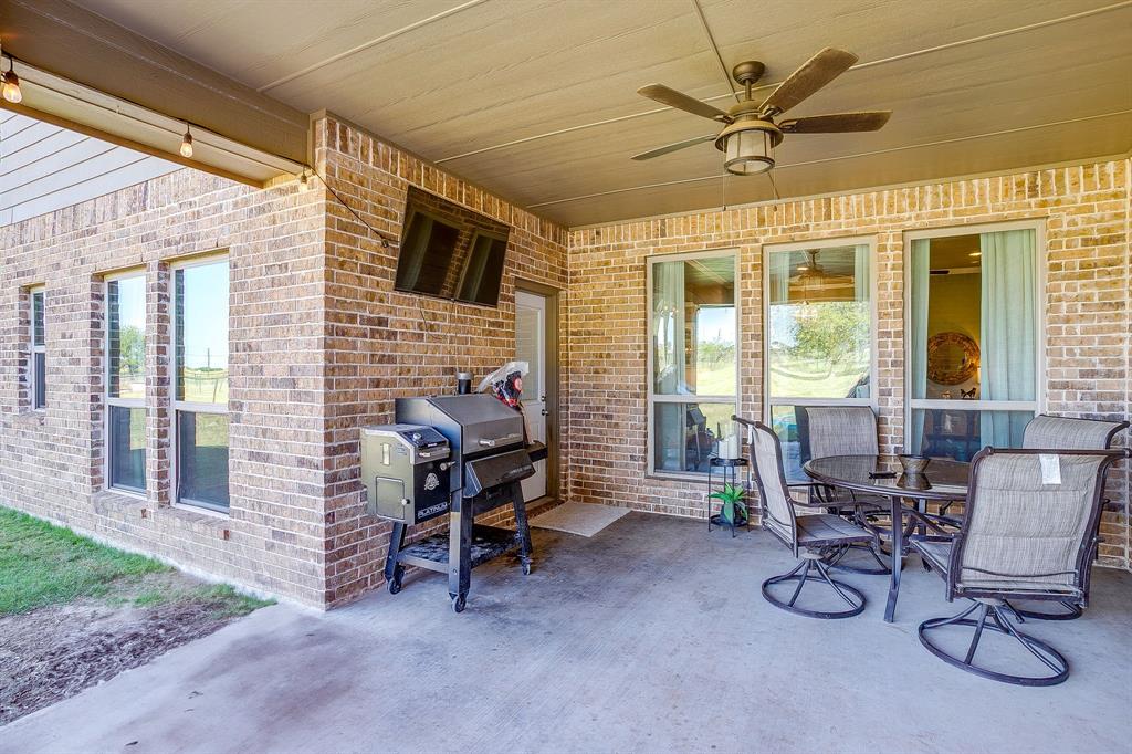 112 Lone Star Way Godley, TX 76044 - Photo 33 of 40 a view of a livingroom with furniture and a grill