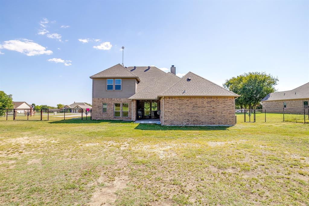 112 Lone Star Way Godley, TX 76044 - Photo 37 of 40 a front view of house with outdoor space and swimming pool