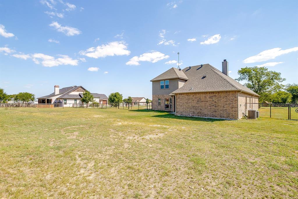 112 Lone Star Way Godley, TX 76044 - Photo 38 of 40 a front view of house with outdoor space and swimming pool