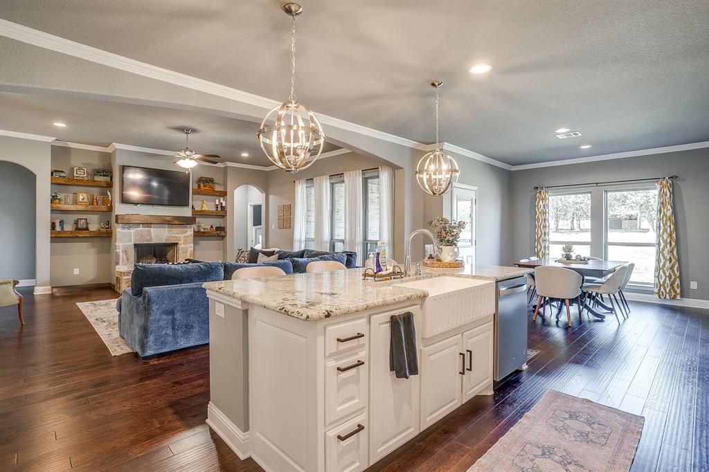 112 Lone Star Way Godley, TX 76044 - Photo 8 of 40 a large white kitchen with lots of counter space a sink and appliances