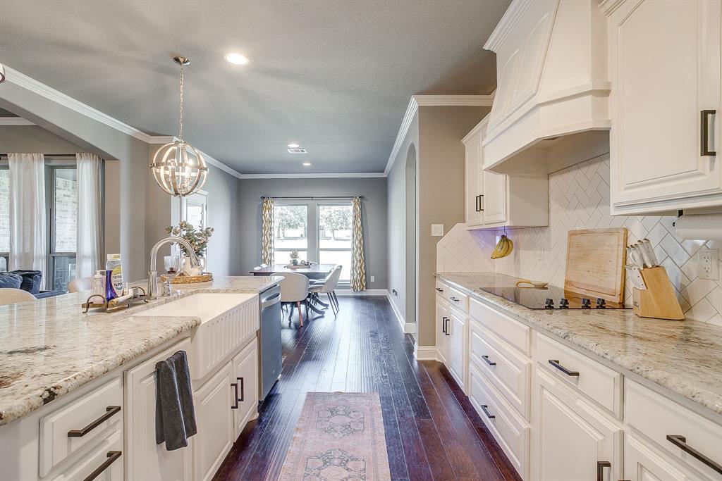 112 Lone Star Way Godley, TX 76044 - Photo 10 of 40 a large kitchen with lots of counter space a sink and appliances