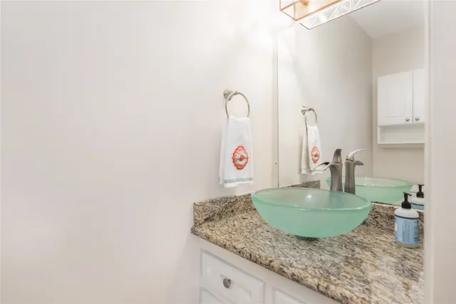 a view of a room with a ceiling fan and window