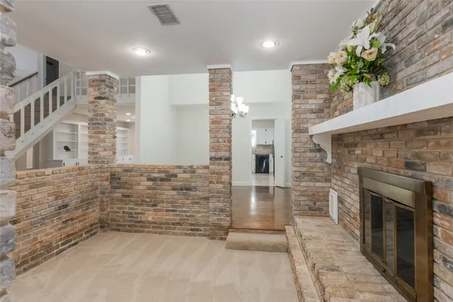 an empty room with entrance and stairs