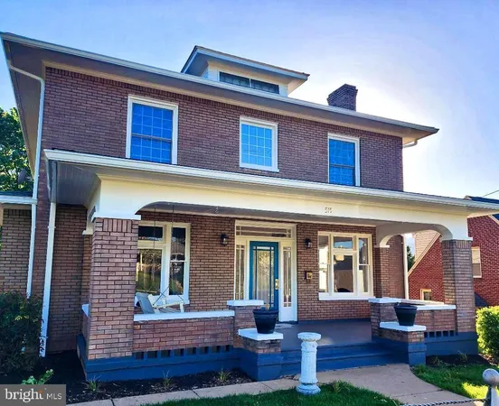 a view of house with front door and wooden floor