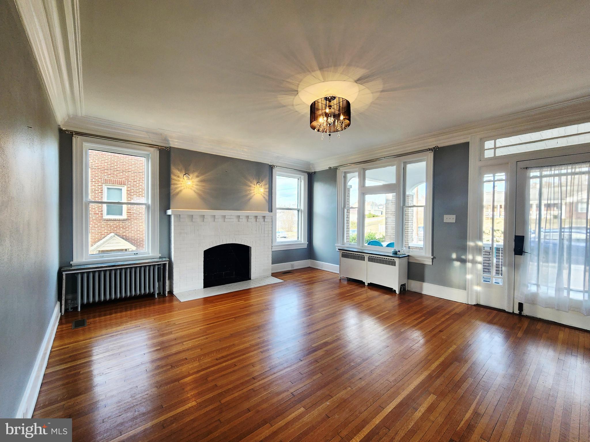 515 Fourth Street Shenandoah, VA 22849 - Photo 11 of 69 an empty room with windows and fireplace