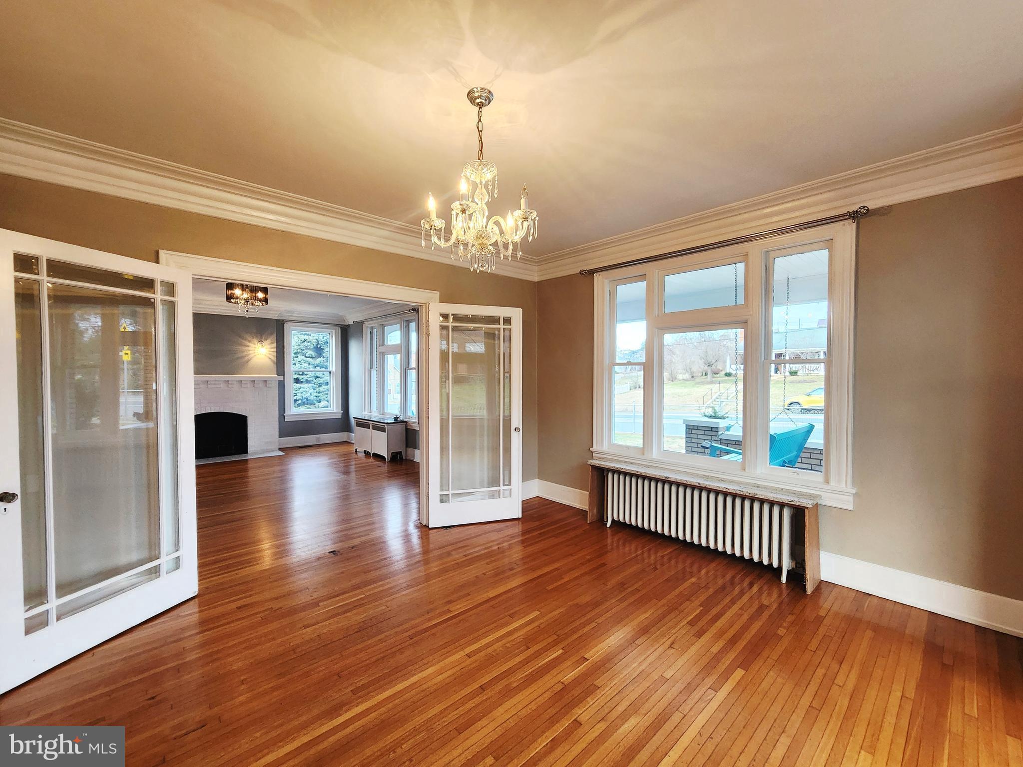515 Fourth Street Shenandoah, VA 22849 - Photo 14 of 69 a view of an empty room with wooden floor and a window