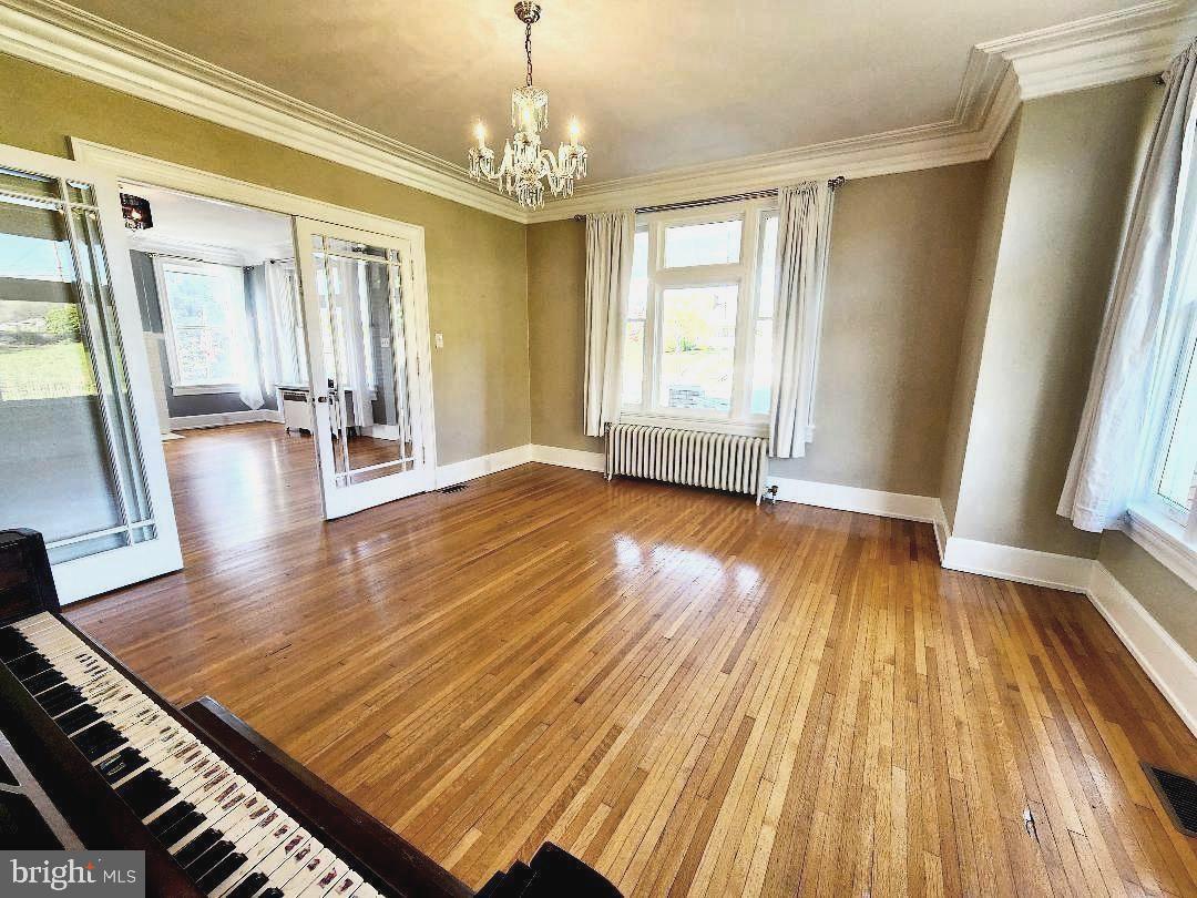 515 Fourth Street Shenandoah, VA 22849 - Photo 16 of 69 a view of an empty room with wooden floor and a window
