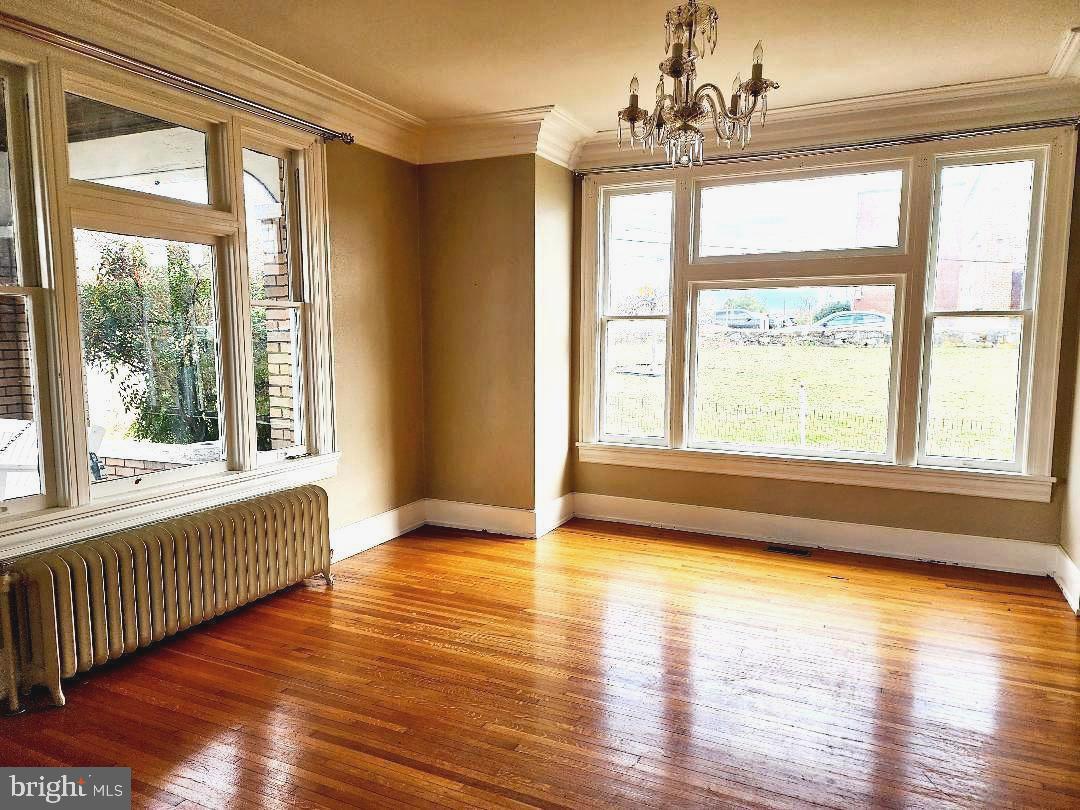 515 Fourth Street Shenandoah, VA 22849 - Photo 17 of 69 a view of an empty room with wooden floor and a window