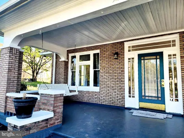 a view of a porch with furniture