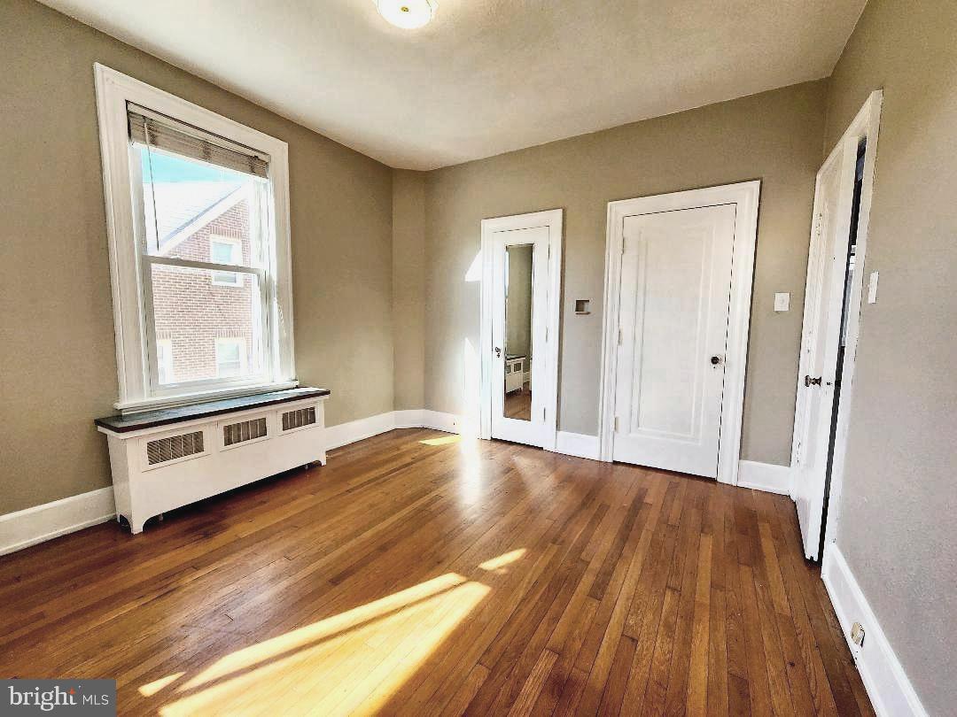 515 Fourth Street Shenandoah, VA 22849 - Photo 38 of 69 a view of an empty room with wooden floor and a window