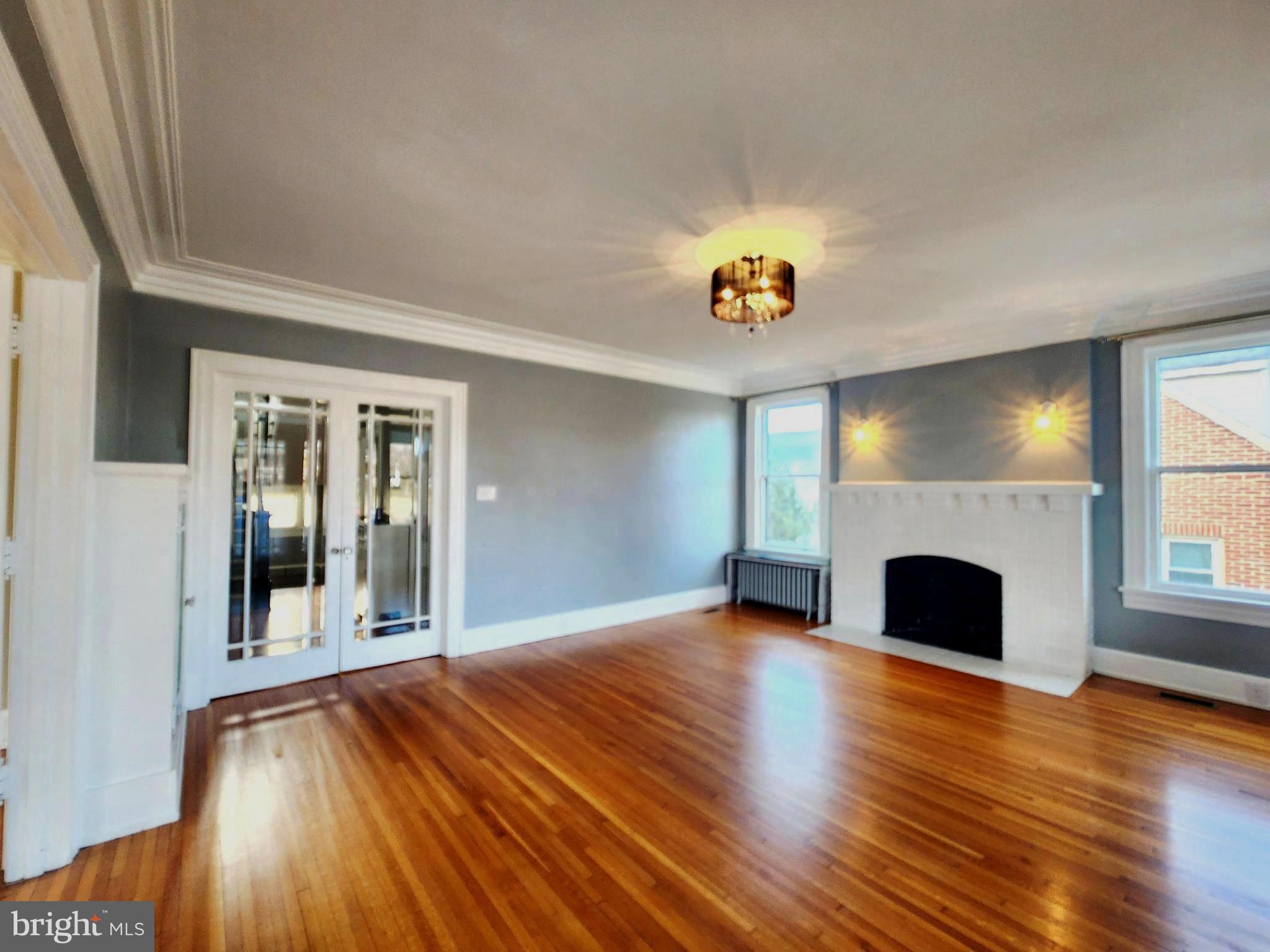 515 Fourth Street Shenandoah, VA 22849 - Photo 9 of 69 a view of an empty room with wooden floor and a window