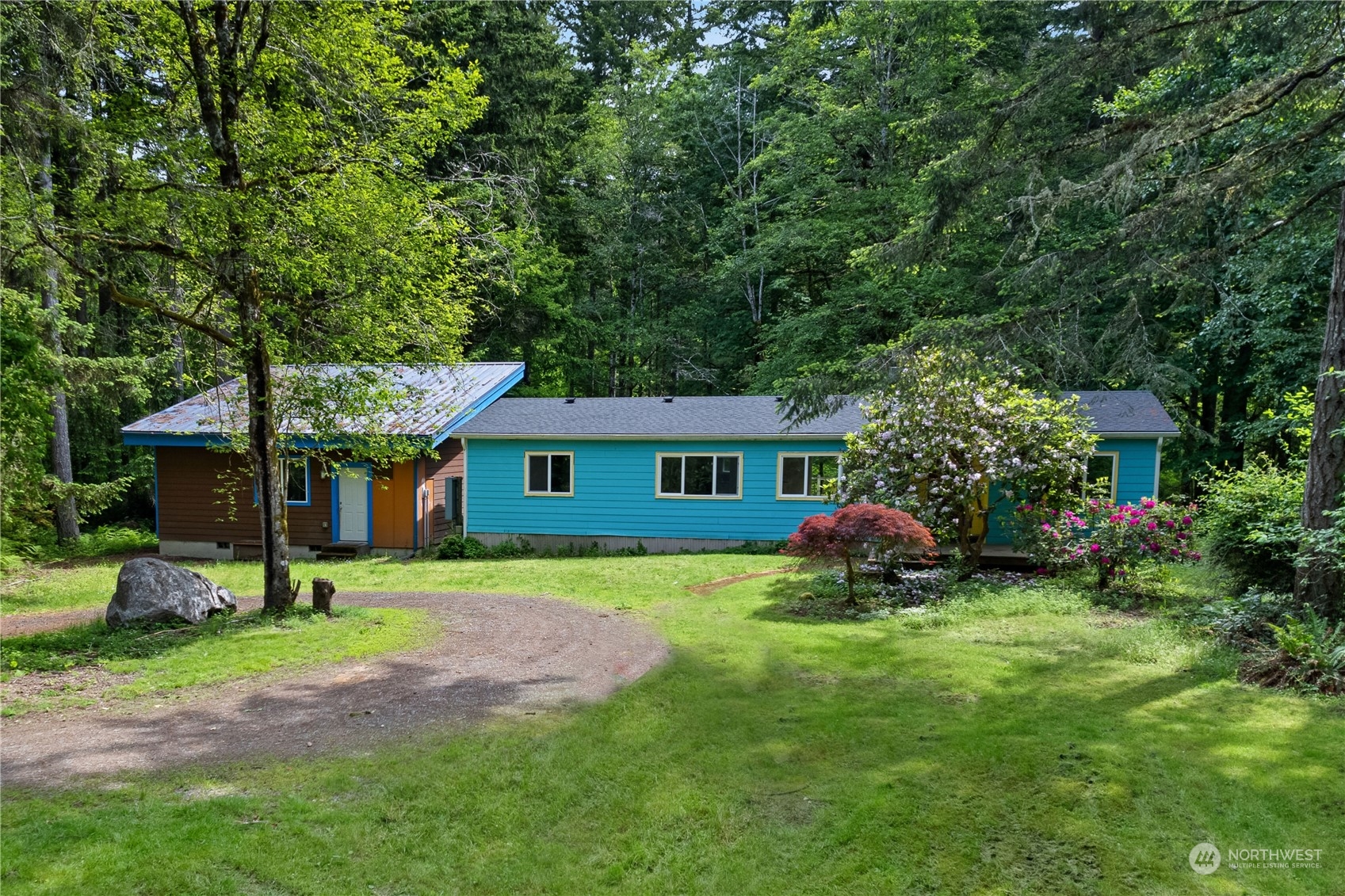7342 Steamboat Island Road Northwest Olympia, WA 98502 - Photo 1 of 40 a view of a house with a yard porch and sitting area