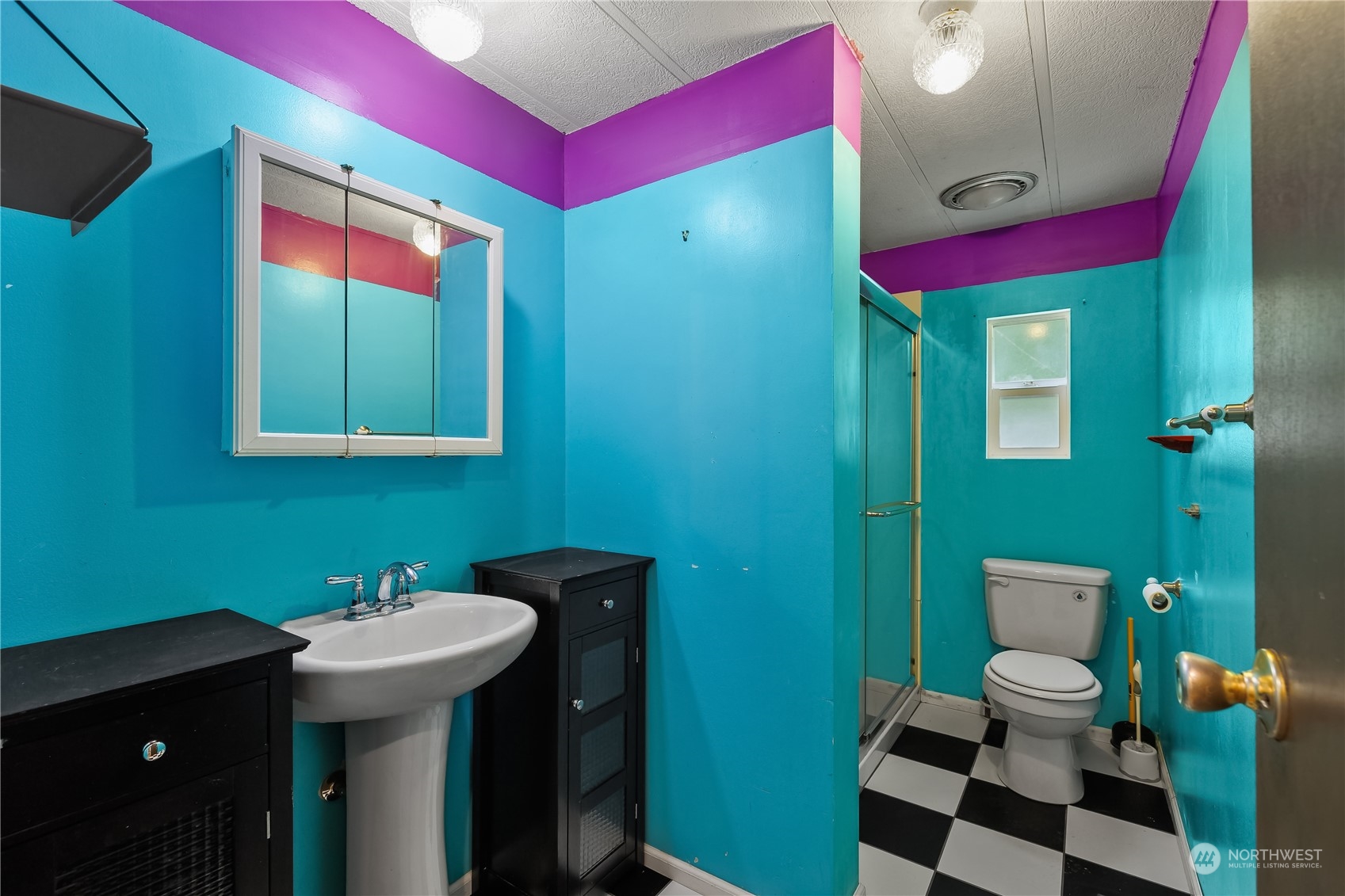 7342 Steamboat Island Road Northwest Olympia, WA 98502 - Photo 20 of 40 a bathroom with a sink mirror toilet and shower