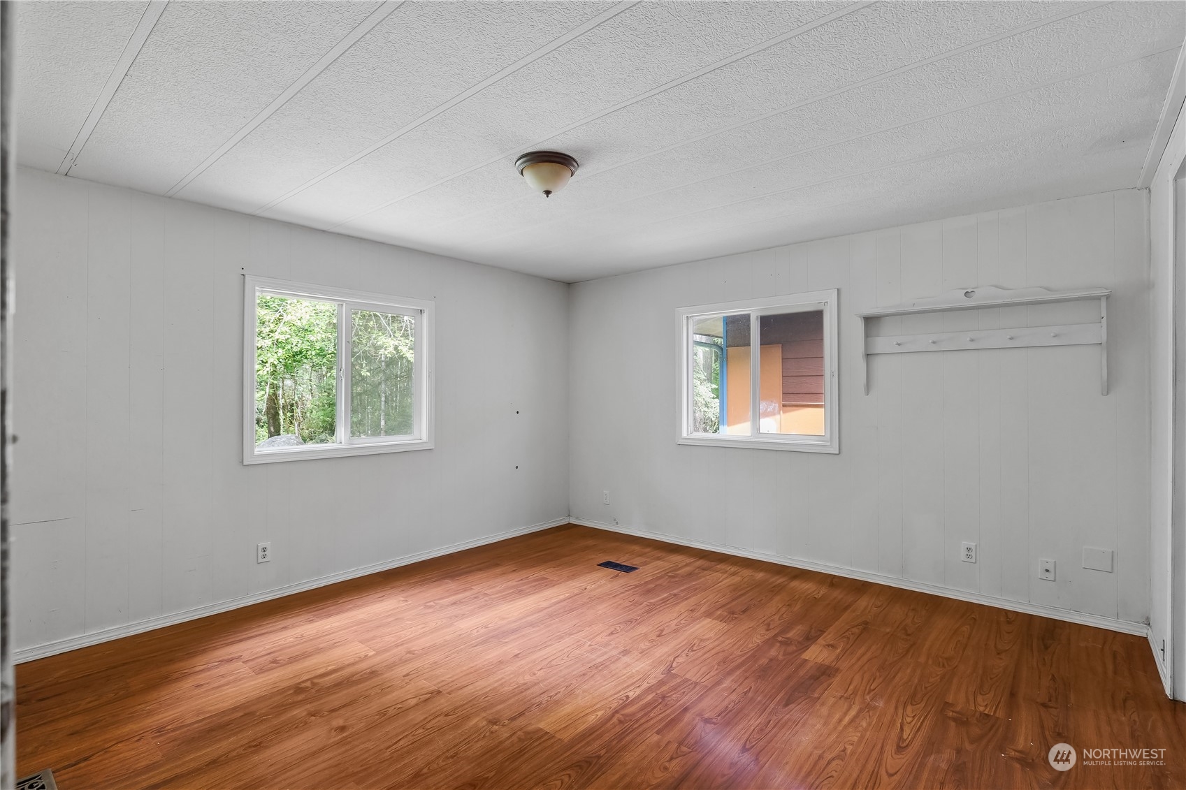 7342 Steamboat Island Road Northwest Olympia, WA 98502 - Photo 21 of 40 wooden floor in an empty room with a window