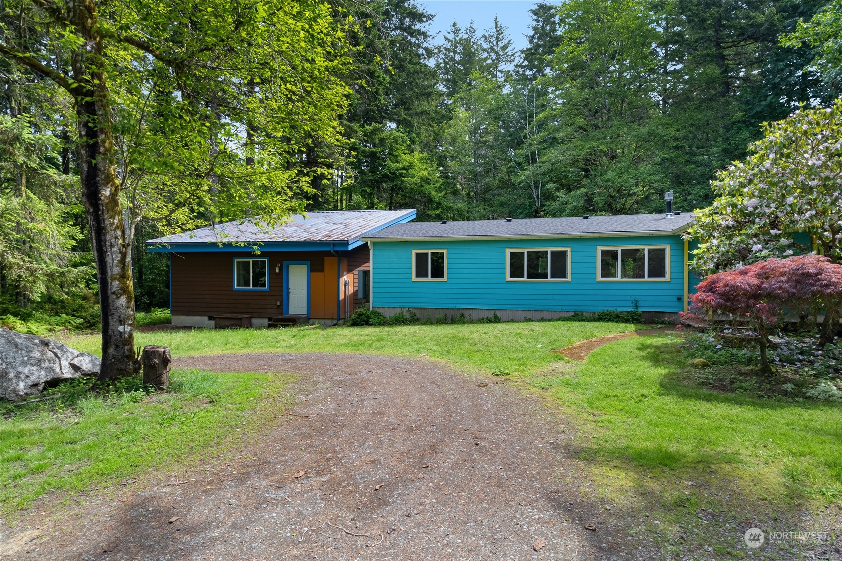 7342 Steamboat Island Road Northwest Olympia, WA 98502 - Photo 35 of 40 a front view of a house with a yard and garage