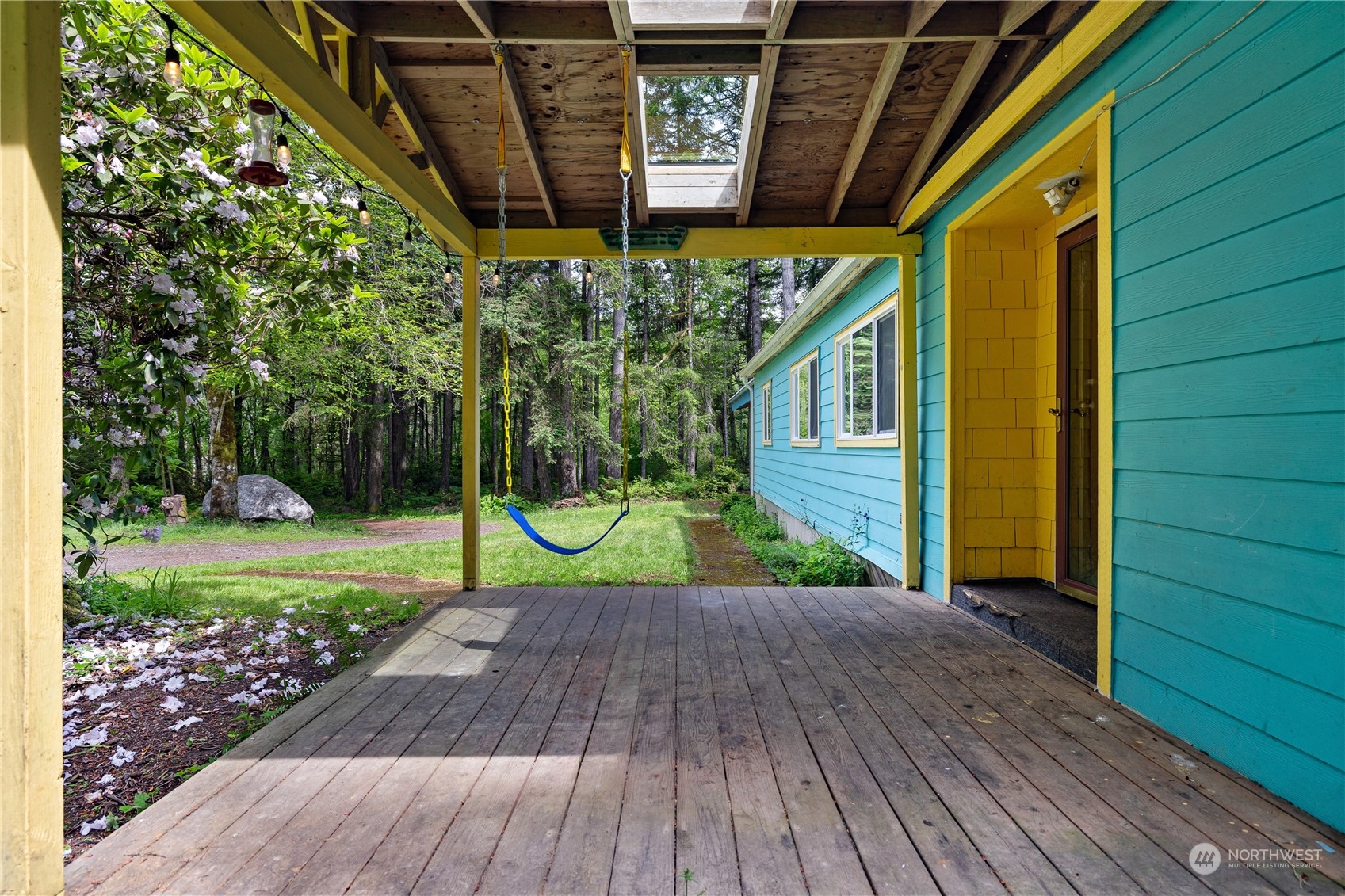 7342 Steamboat Island Road Northwest Olympia, WA 98502 - Photo 6 of 40 a view of a porch with wooden floor and stairs