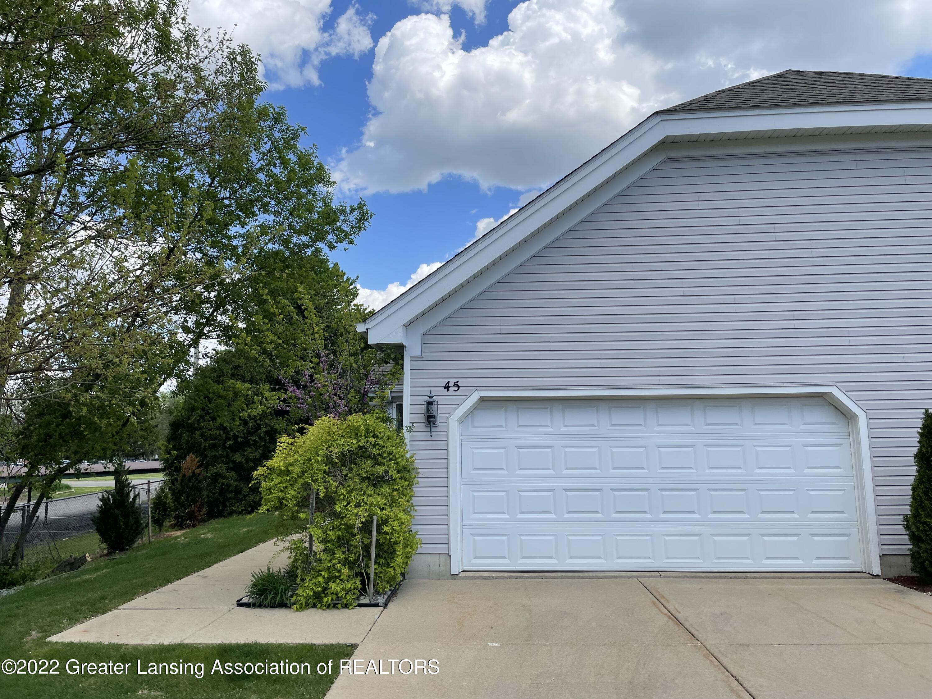 2415 North Aurelius Road, Unit 45 Holt, MI 48842 - Photo 2 of 37 Garage