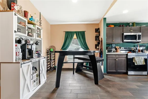 a view of kitchen with furniture and flat screen tv