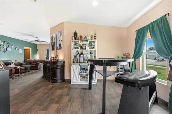a living room with furniture a rug and a large window