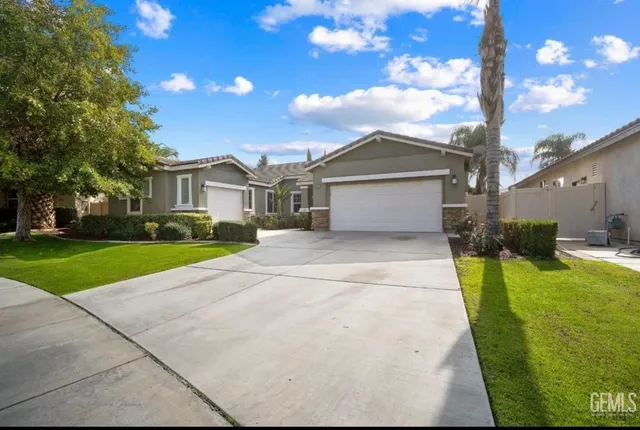 a house view with a garden space