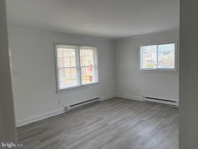 55 North Spring Garden Street Ambler, PA 19002 - Photo 3 of 10 an empty room with wooden floor and windows