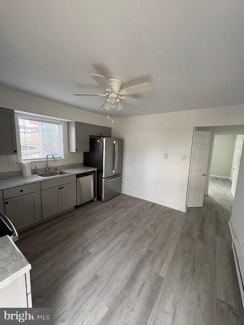 55 North Spring Garden Street Ambler, PA 19002 - Photo 5 of 10 a view of a kitchen with a sink dishwasher cabinets and wooden floor