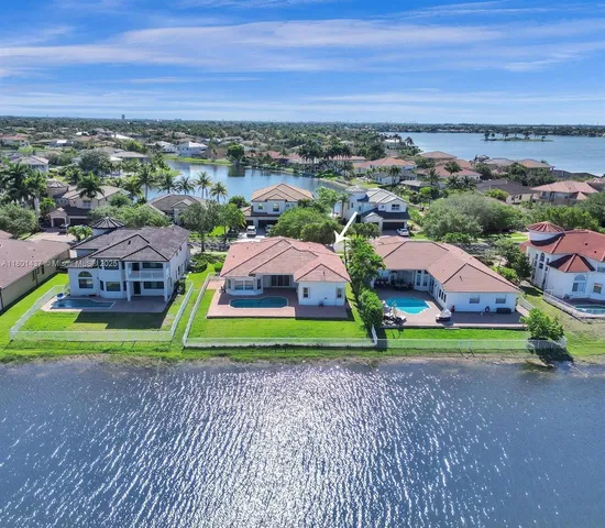 an aerial view of a house with a garden and yard view