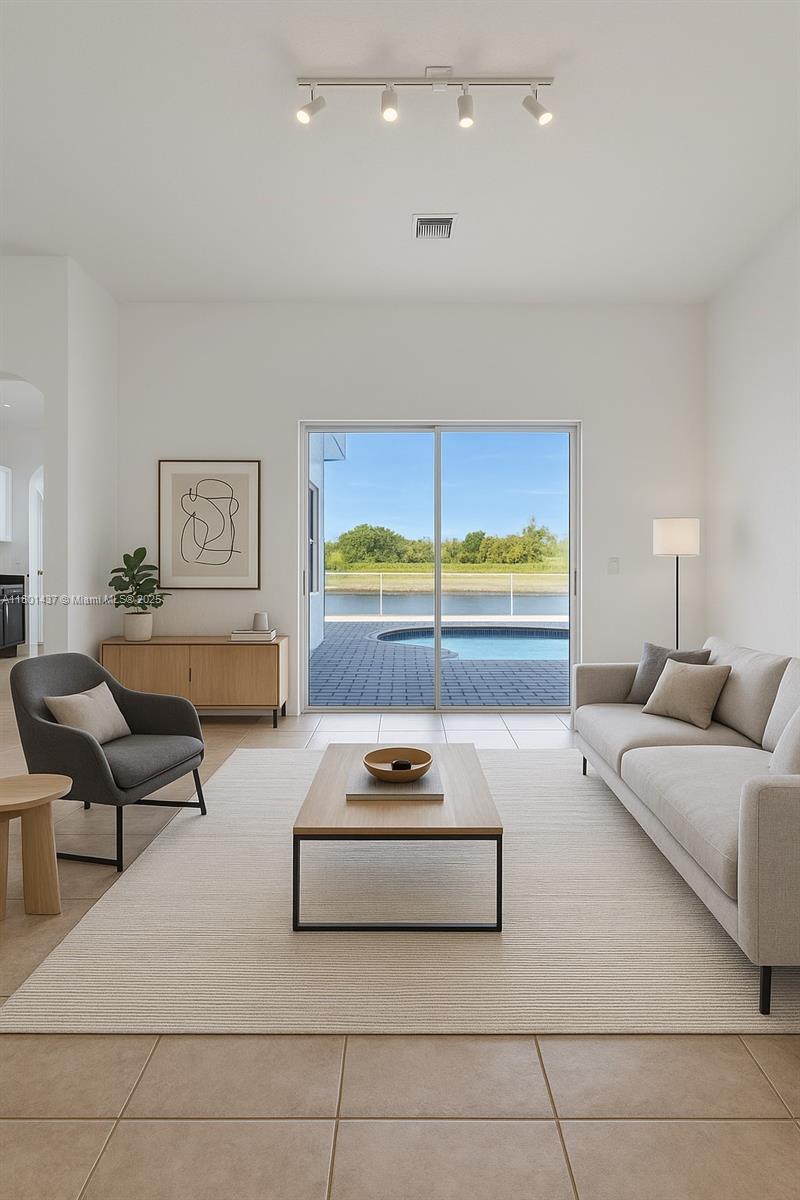 3360 Southwest 195th Terrace Miramar, FL 33029 - Photo 11 of 65 a living room with furniture and a large window