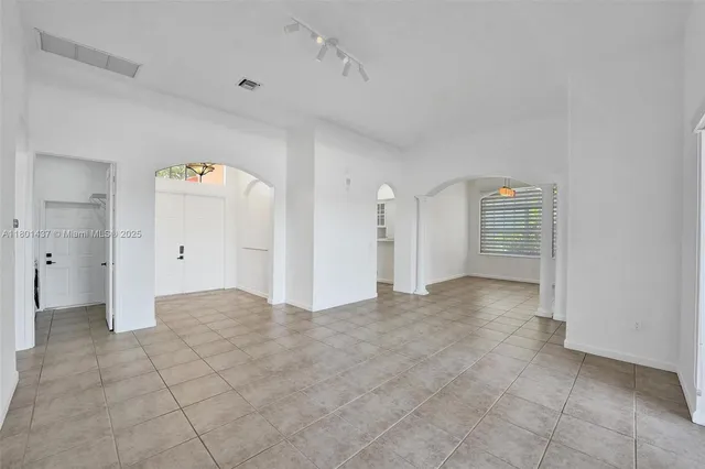 a kitchen with stainless steel appliances a sink stove and refrigerator