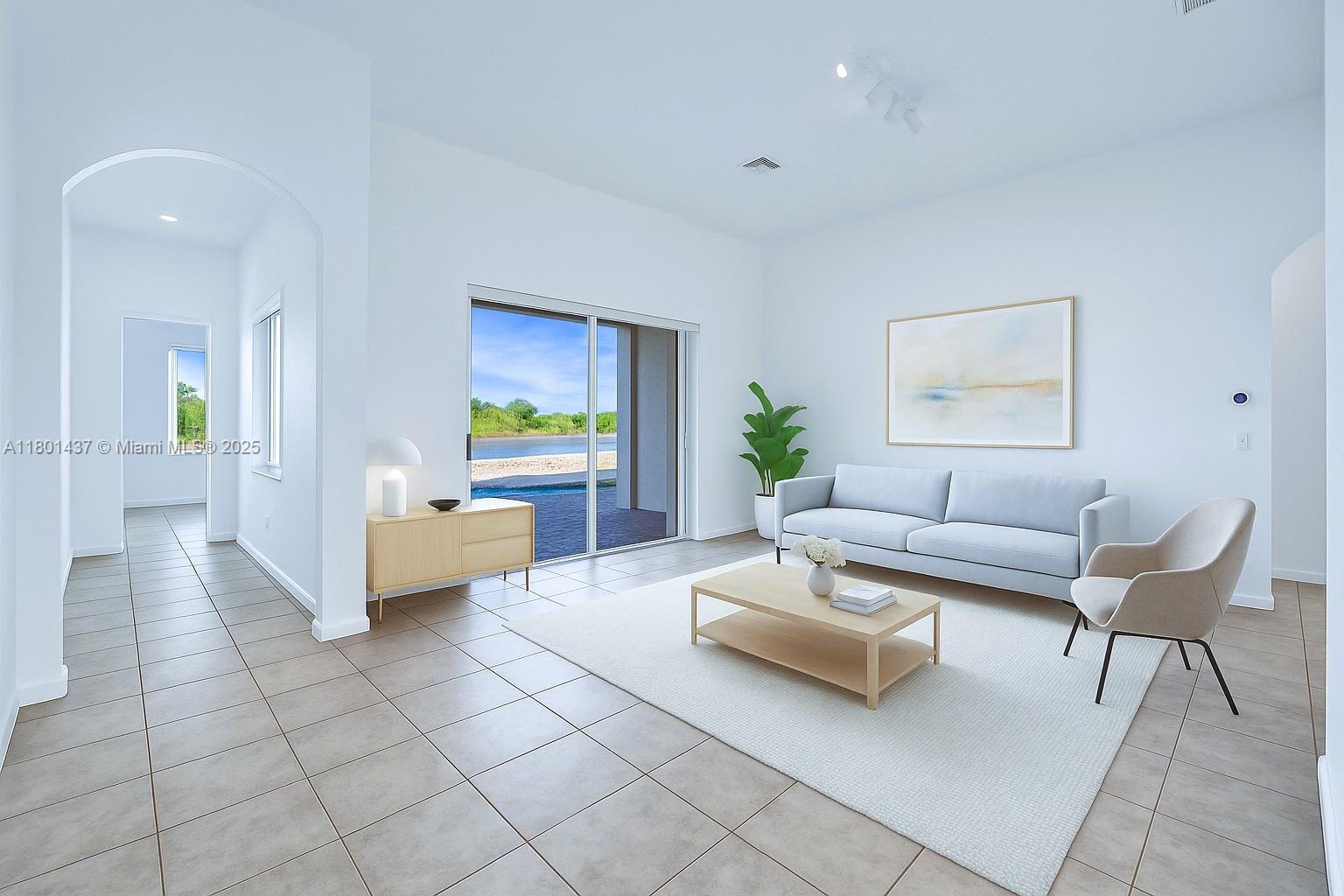 3360 Southwest 195th Terrace Miramar, FL 33029 - Photo 16 of 65 a living room with furniture and painting on the wall