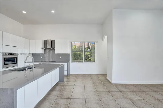 aerial view of a house with a lake view