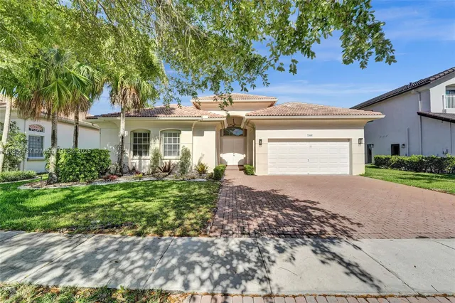 a view of a lake with houses in the background