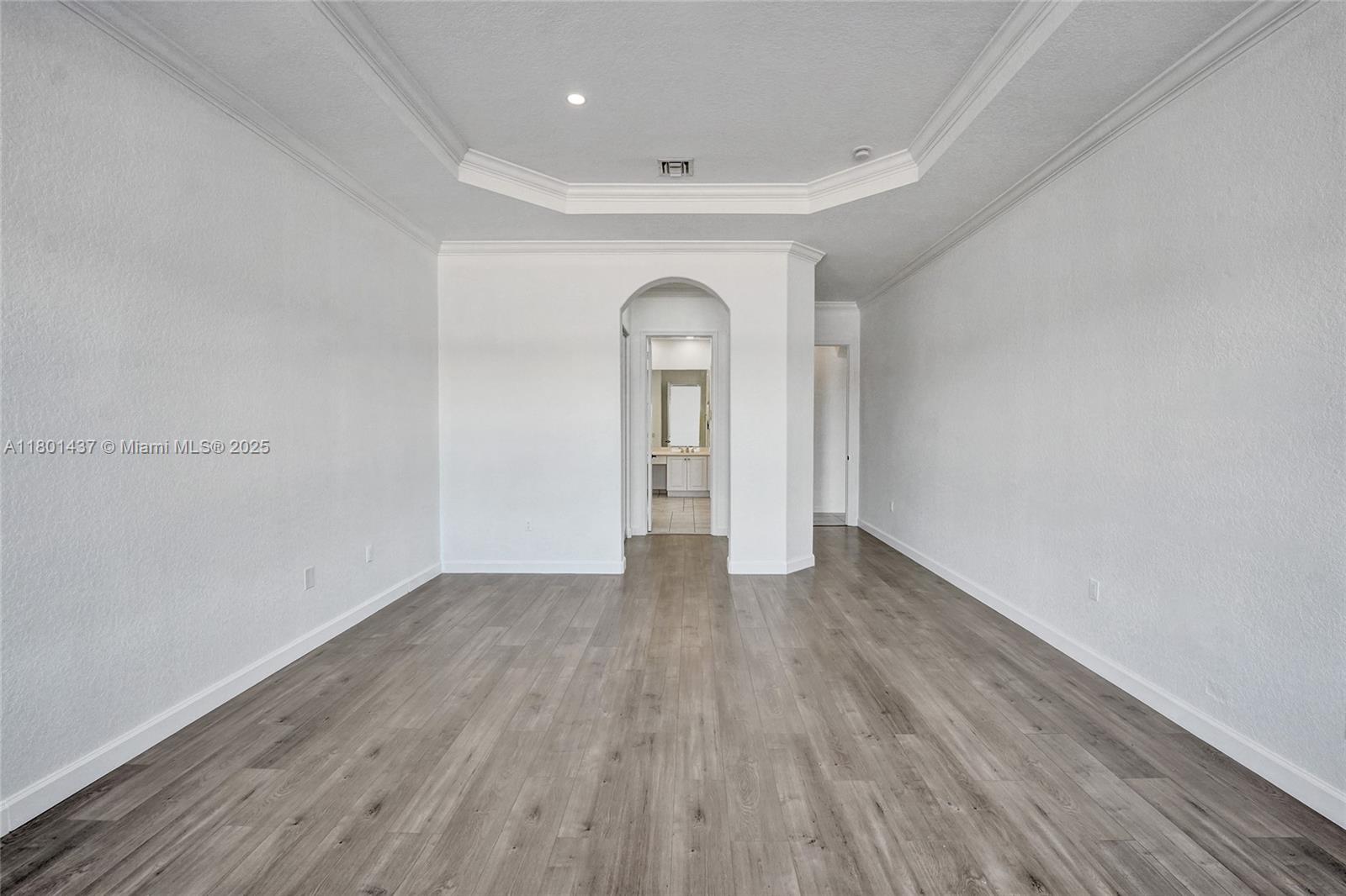 3360 Southwest 195th Terrace Miramar, FL 33029 - Photo 31 of 65 a view of an empty room with wooden floor and a window