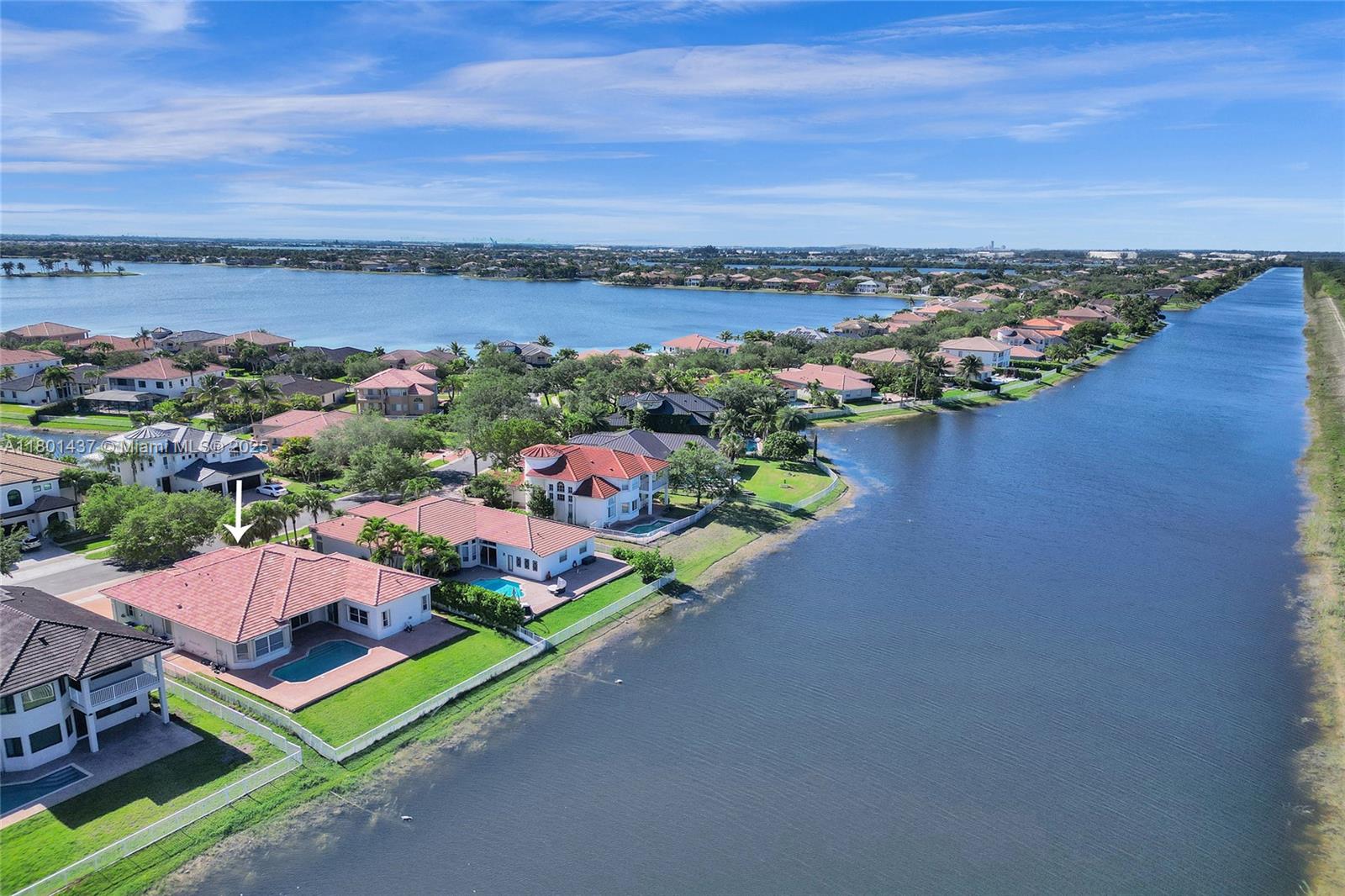 3360 Southwest 195th Terrace Miramar, FL 33029 - Photo 54 of 65 an aerial view of lake and residential houses with outdoor space